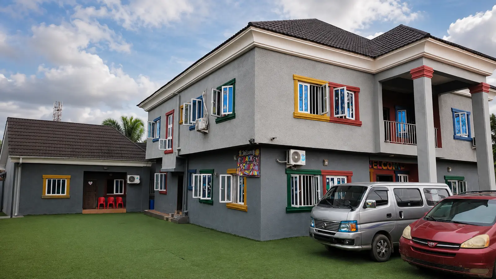 Petra Academy campus building and school vehicles