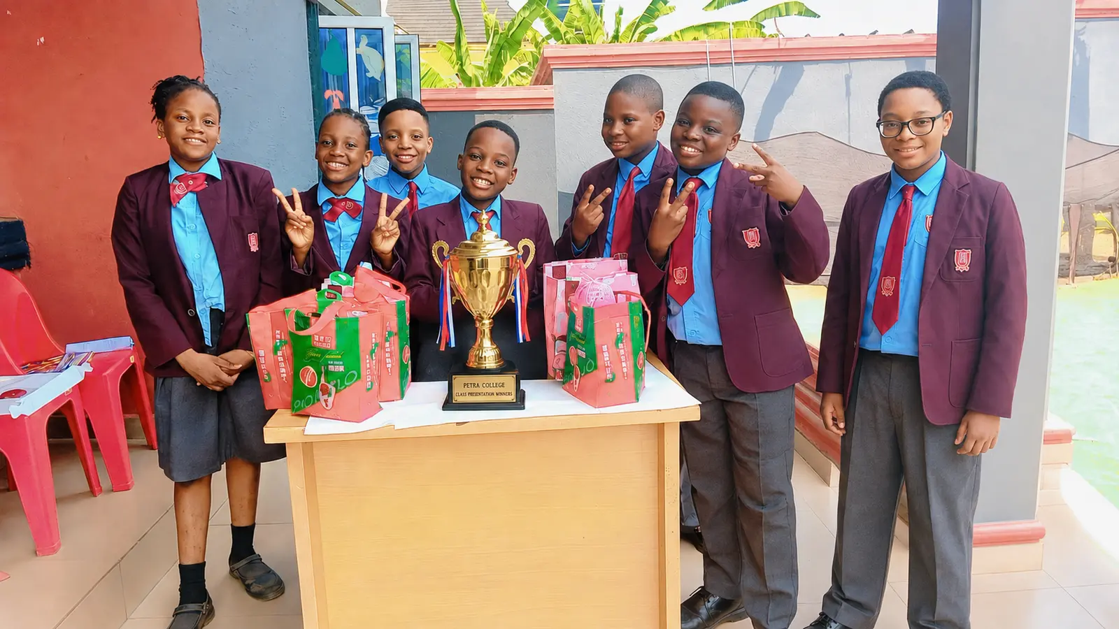 Petra College class presentation winners celebrating with their trophy and prizes