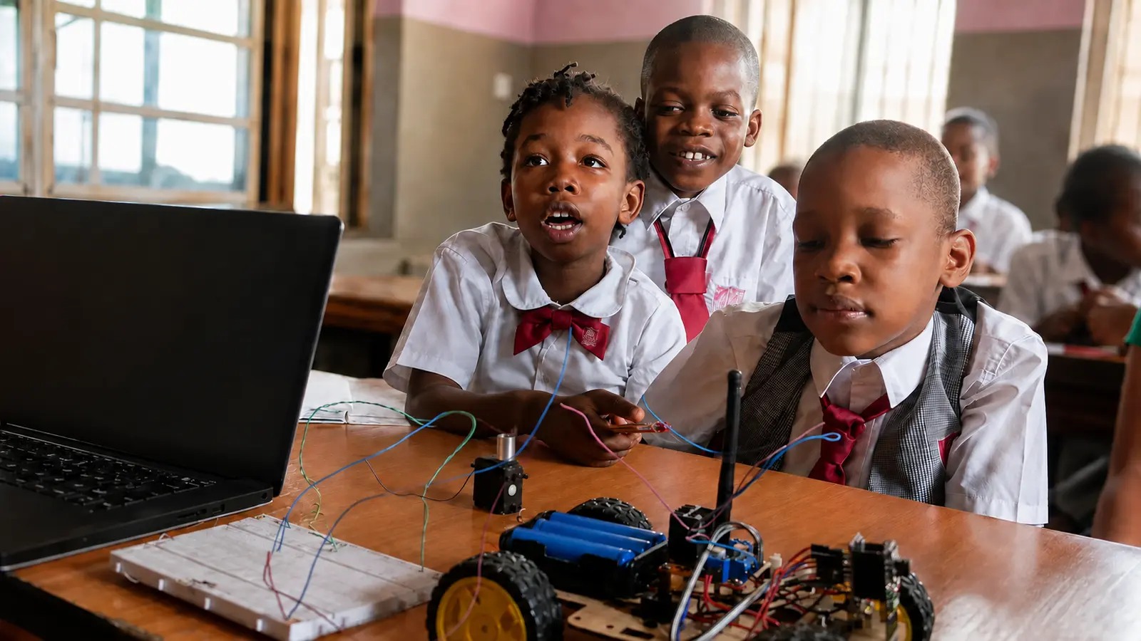 Petra Academy pupils building and testing a robotics project