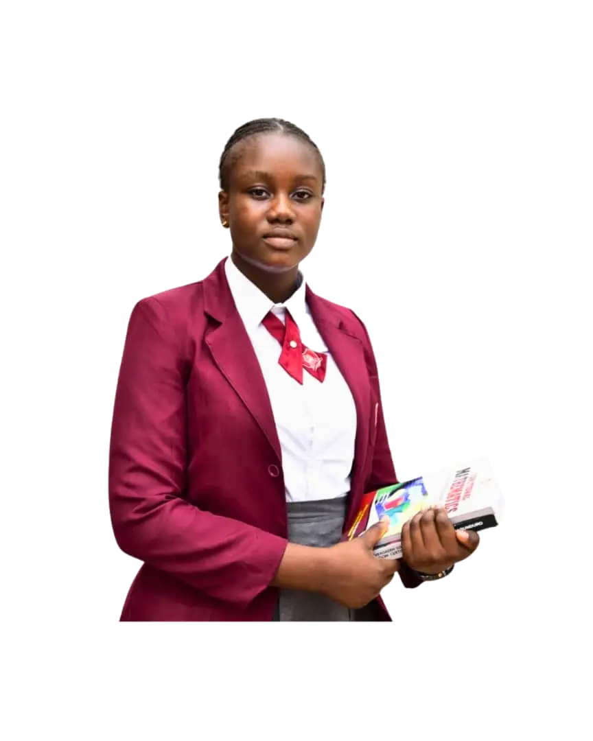 Petra Academy student holding her books